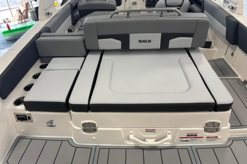 Slide: The Image of 2026 Chaparral SSX 4 boat interior with gray seating and cup holders. - 12