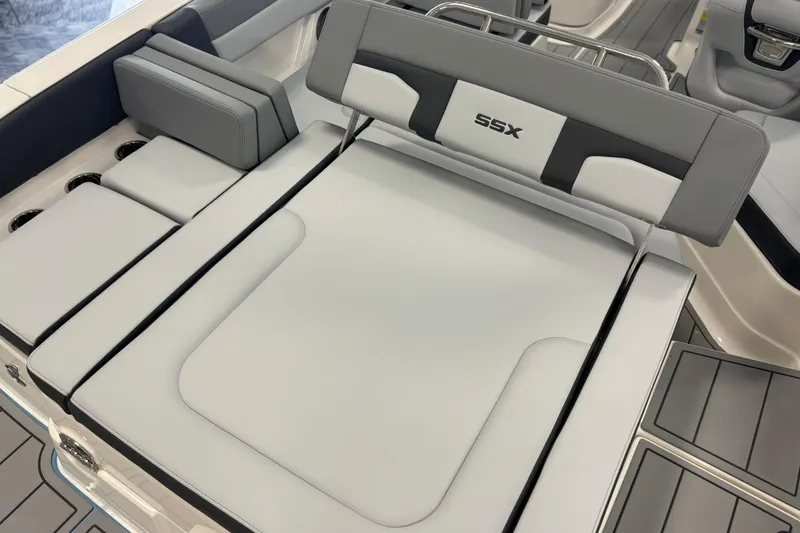 Slide: The Image of 2026 Chaparral SSX 4 boat interior with sleek, modern seating and SSX branding. - 13