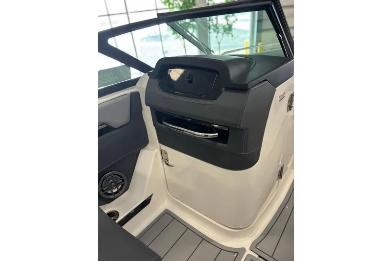 Slide: The Image of Interior view of 2026 Chaparral SSX 4 boat, featuring sleek design and modern controls. - 20