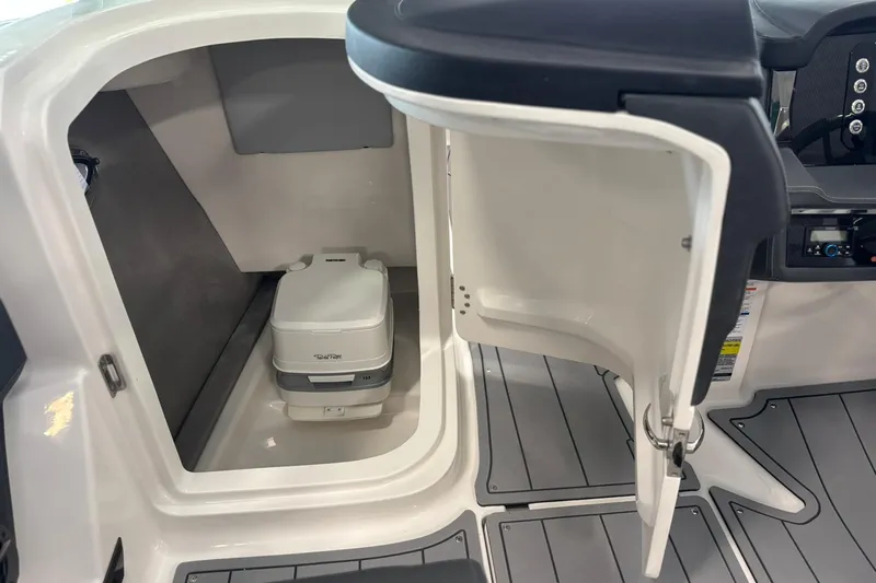 Slide: The Image of 2026 Chaparral SSX 4 boat interior with compact portable toilet. - 21