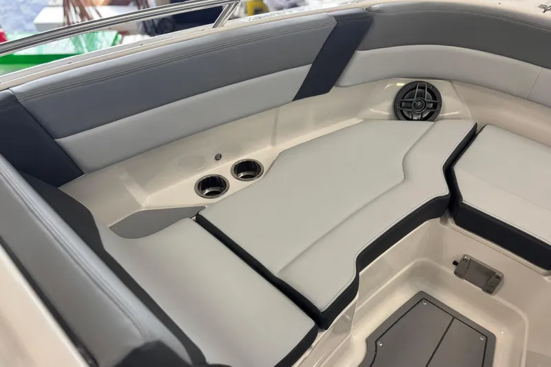 Slide: The Image of 2026 Chaparral SSX 4 boat interior with cushioned seating and built-in speakers. - 32