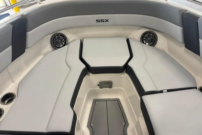 Slide: The Image of 2026 Chaparral SSX 4 boat interior with cushioned seating and built-in speakers. - 33