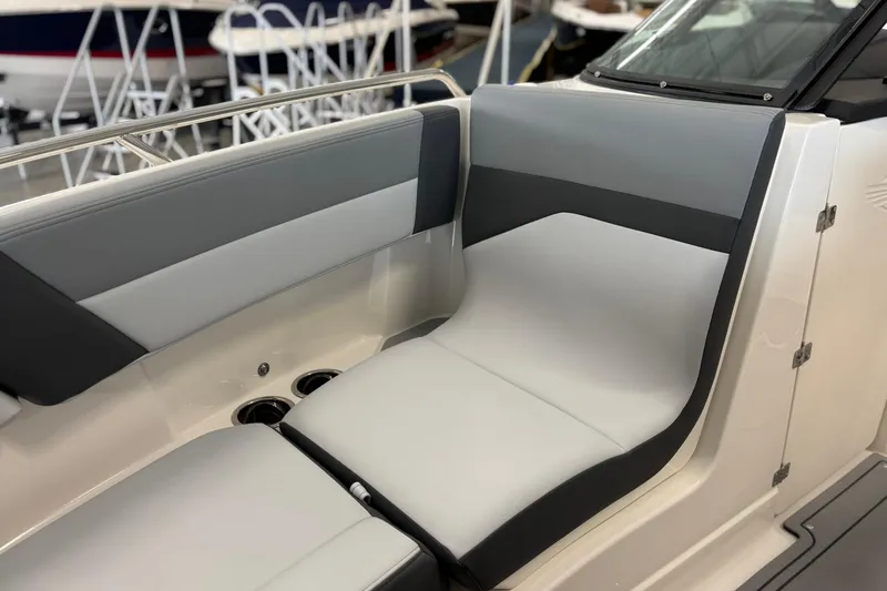 Slide: The Image of 2026 Chaparral SSX 4 boat interior with sleek gray and white seating design. - 34