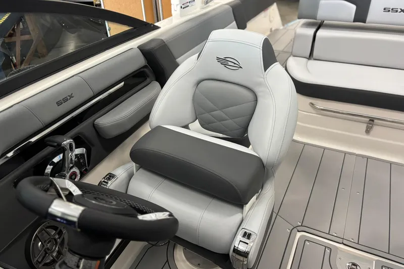 Slide: The Image of 2026 Chaparral SSX 4 boat interior with luxurious seating and modern steering wheel design. - 36