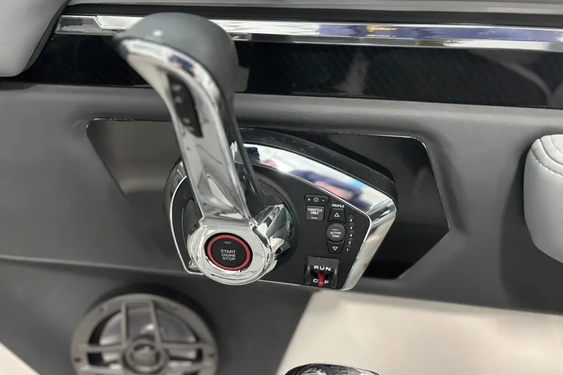 Slide: The Image of Control panel of 2026 Chaparral SSX 4 boat with start/stop button and throttle lever. - 38