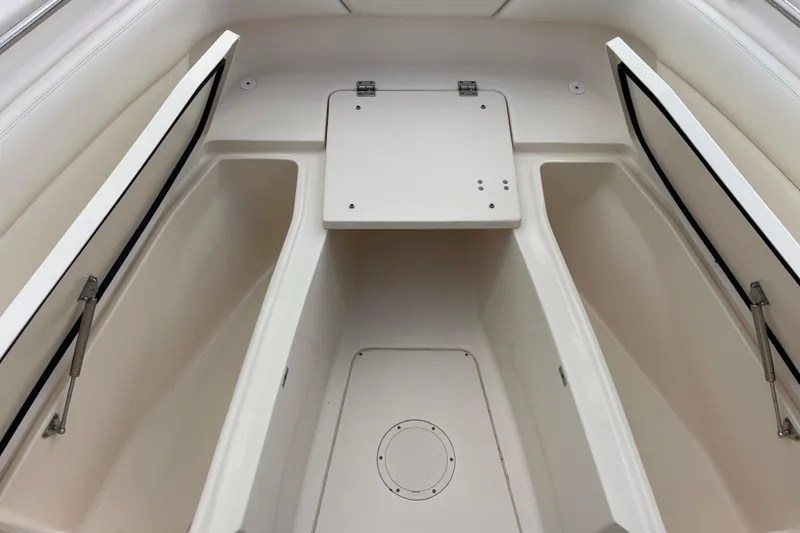 Slide: The Image of 2021 Grady-White Canyon 271 boat storage compartments, open and spacious design. - 2