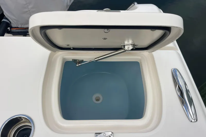 Slide: The Image of Open hatch on 2021 Grady-White Canyon 271 boat, showcasing interior compartment. - 4