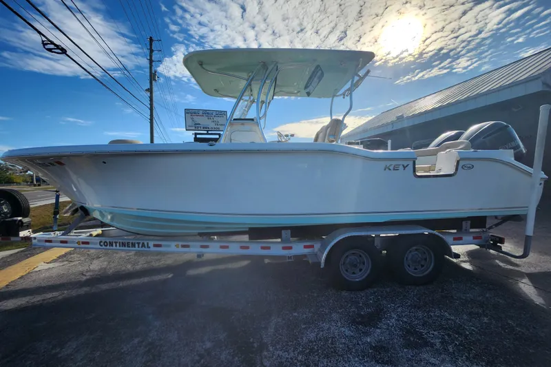 The Image of 2018 Key West 263 FS boat on trailer under sunny sky. - 0