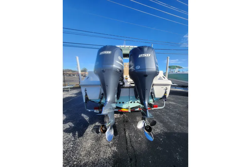 Slide: The Image of 2018 Key West 263 FS boat with dual 250 horsepower outboard engines. - 2