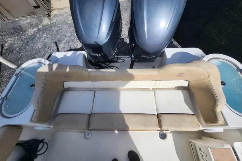 Slide: The Image of 2018 Key West 263 FS boat with dual engines and cushioned seating. - 3