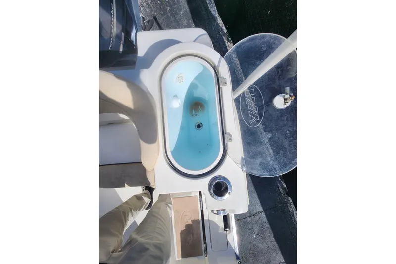 Slide: The Image of 2018 Key West 263 FS boat livewell with clear lid and fishing rod holder. - 4