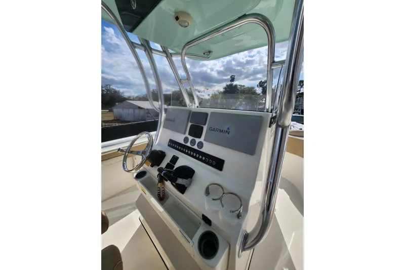 Slide: The Image of 2018 Key West 263 FS boat console with Garmin navigation system and steering wheel. - 7