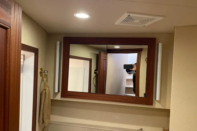 Slide: The Image of Bathroom mirror in 2003 Northern Marine 57 Raised Pilothouse yacht, reflecting stairs and interior. - 10