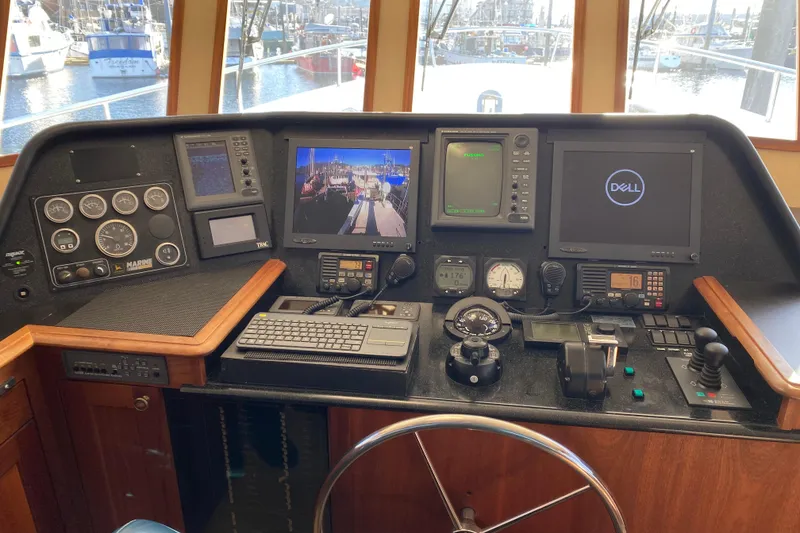 Slide: The Image of Pilothouse interior of 2003 Northern Marine 57 Raised Pilothouse with navigation equipment. - 12