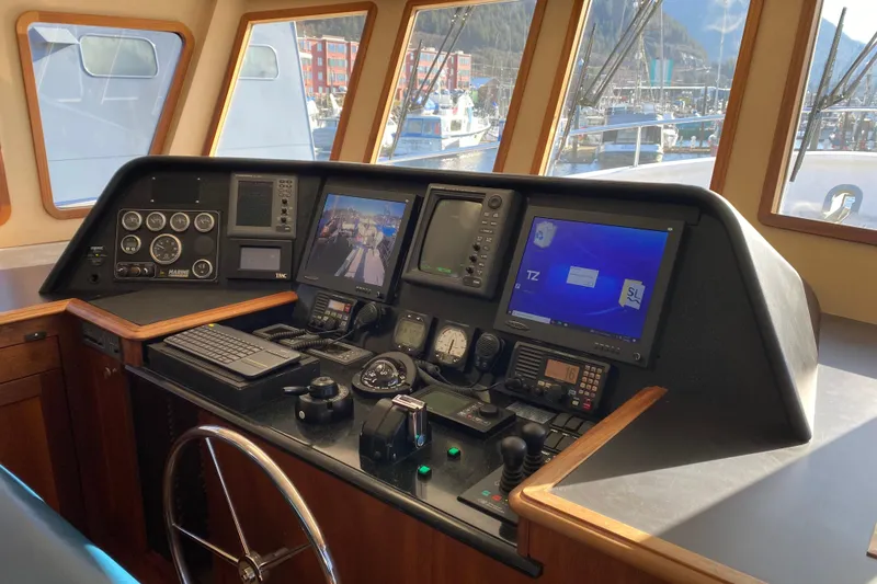 Slide: The Image of Pilothouse interior of 2003 Northern Marine 57 Raised Pilothouse yacht with navigation equipment. - 14