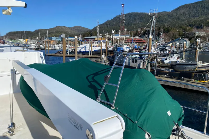 Slide: The Image of 2003 Northern Marine 57 Raised Pilothouse yacht docked at a scenic marina. - 15