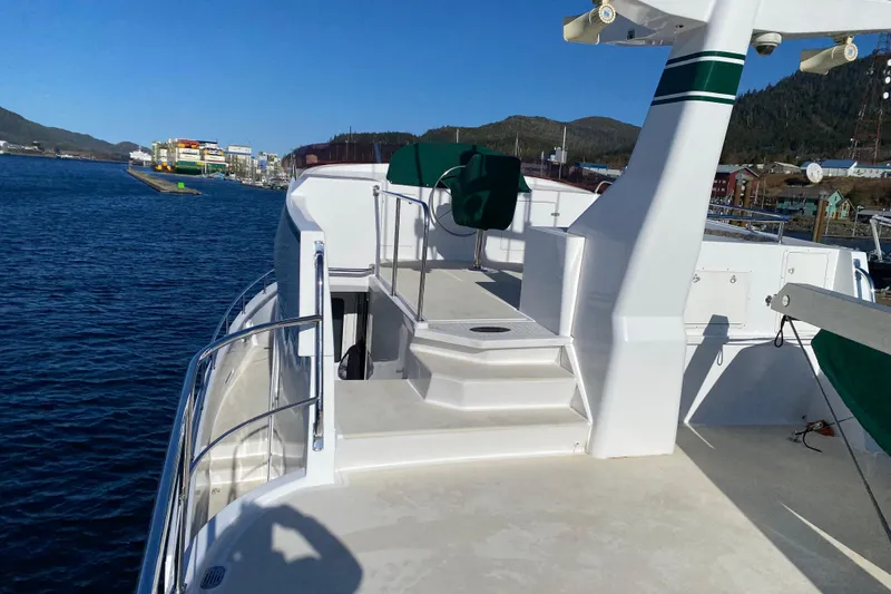 Slide: The Image of 2003 Northern Marine 57 Raised Pilothouse yacht deck with scenic harbor view. - 17