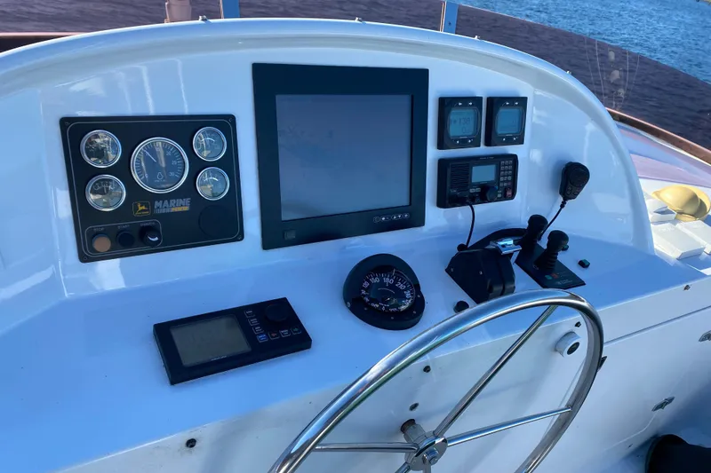 Slide: The Image of Control panel of 2003 Northern Marine 57 Raised Pilothouse yacht with navigation instruments. - 19