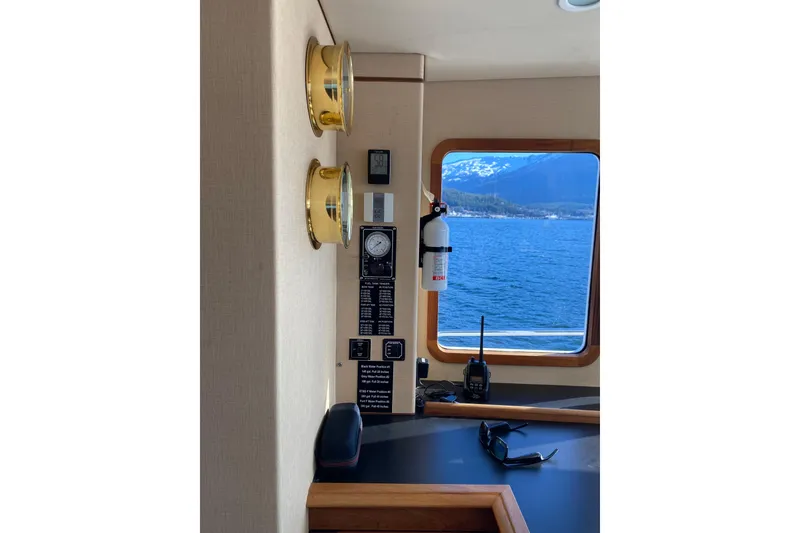 Slide: The Image of Interior of 2003 Northern Marine 57 Raised Pilothouse with ocean view and nautical instruments. - 21