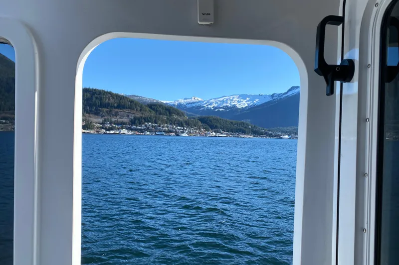 Slide: The Image of View from Northern Marine 57 Raised Pilothouse, 2003, overlooking scenic mountains and water. - 22