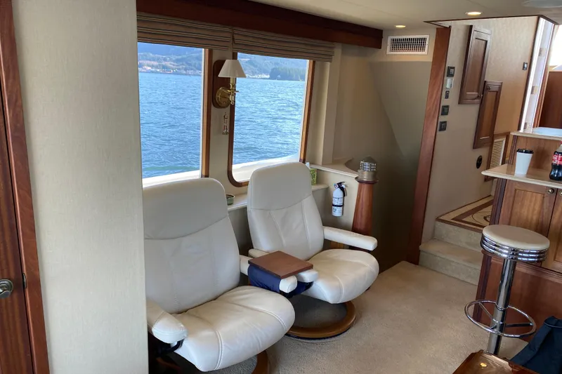 Slide: The Image of Luxurious interior of 2003 Northern Marine 57 Raised Pilothouse yacht with comfortable seating. - 23