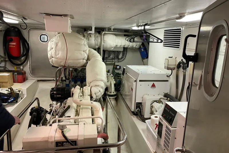 Slide: The Image of Engine room of 2003 Northern Marine 57 Raised Pilothouse yacht, featuring machinery and equipment. - 26