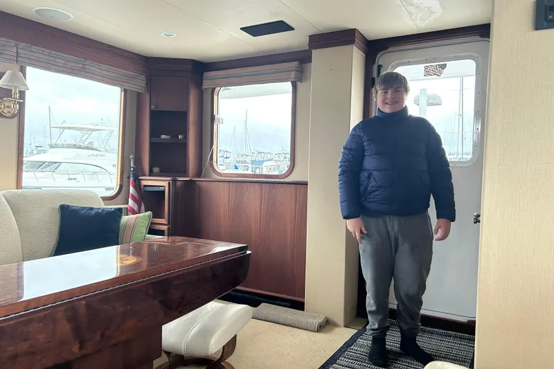 Slide: The Image of Interior of 2004 Northern Marine 57 Raised Pilothouse with person standing by door. - 36