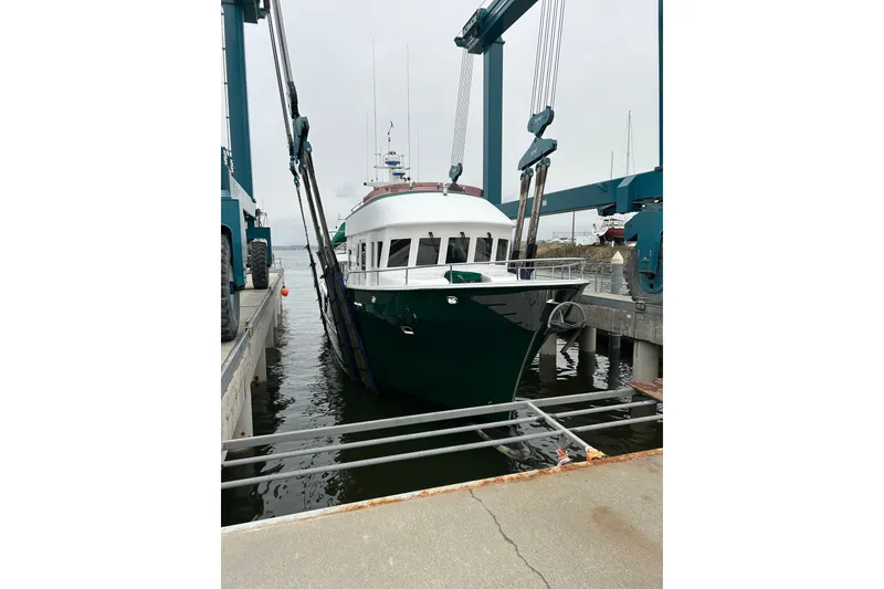 Slide: The Image of 2004 Northern Marine 57 Raised Pilothouse yacht in dry dock, front view. - 38