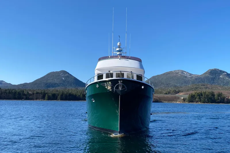 Slide: The Image of Front view of 2003 Northern Marine 57 Raised Pilothouse yacht on scenic water. - 4