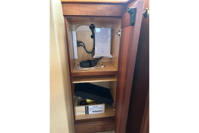 Slide: The Image of Cabinet interior with electronic equipment on Northern Marine 57 Raised Pilothouse, 2004 model. - 40