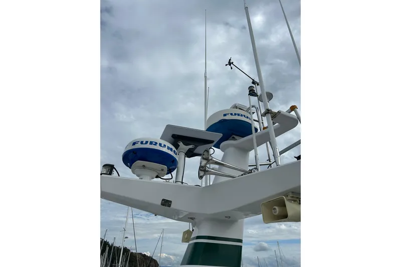 Slide: The Image of Radar equipment on 2004 Northern Marine 57 Raised Pilothouse against cloudy sky. - 43