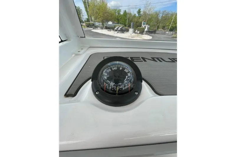 Slide: The Image of Compass on 2022 Century 2400 Center Console boat dashboard, outdoor view. - 10
