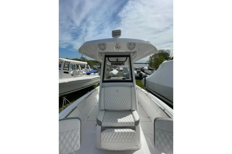 Slide: The Image of 2022 Century 2400 Center Console boat with sleek design and comfortable seating. - 11