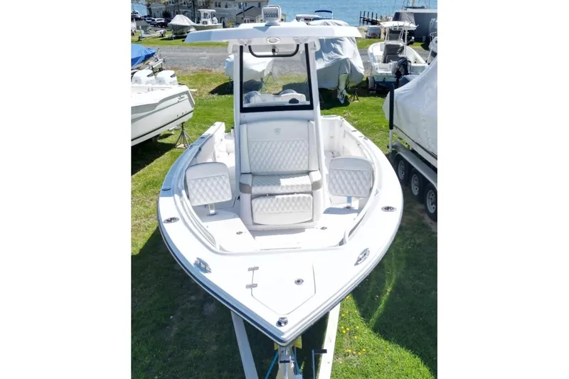 Slide: The Image of 2022 Century 2400 Center Console boat on display, featuring sleek design and spacious seating. - 3