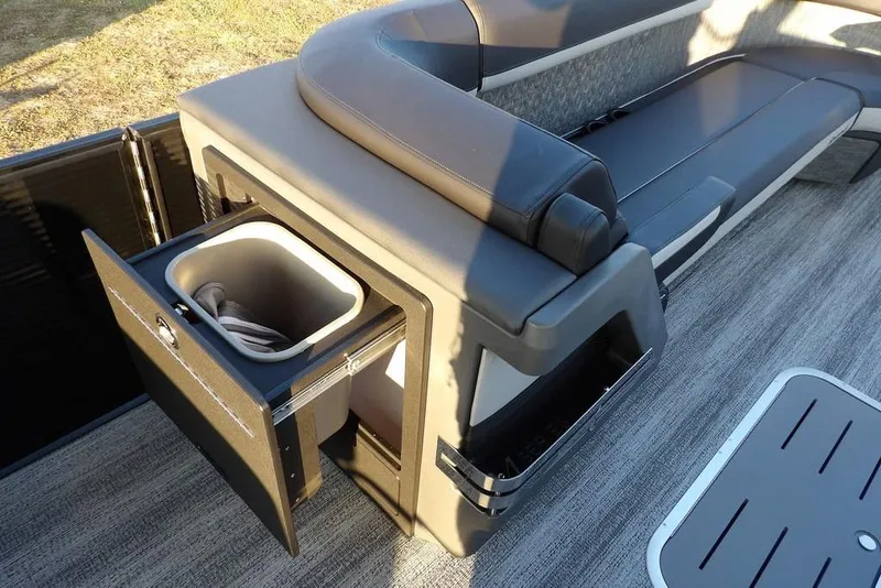 Slide: The Image of 2026 Bennington M Swingback 26 MSB boat interior with storage compartment and seating. - 18