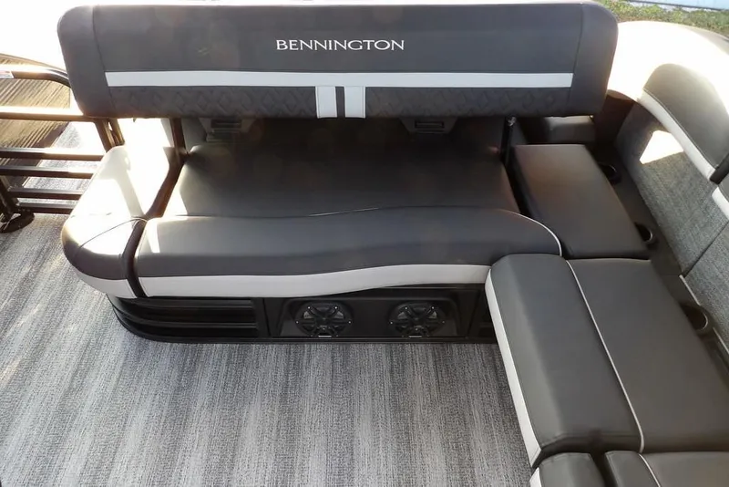 Slide: The Image of 2026 Bennington M Swingback 26 MSB boat seating with sleek black and gray upholstery. - 23