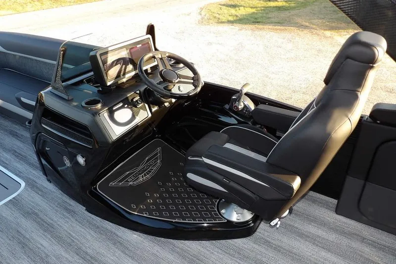 Slide: The Image of 2026 Bennington M Swingback 26 MSB boat interior with sleek helm and modern controls. - 28