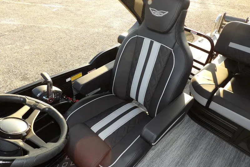 Slide: The Image of 2026 Bennington M Swingback 26 MSB boat interior with luxury seating and steering wheel. - 32