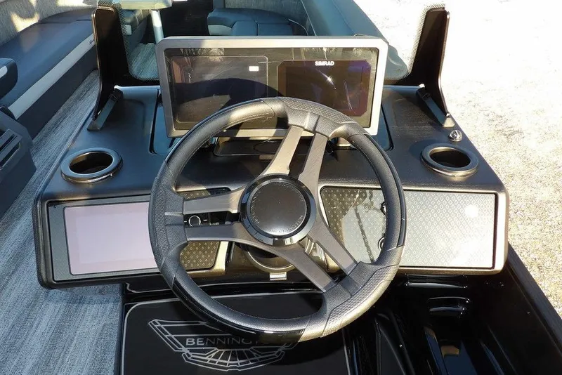 Slide: The Image of 2026 Bennington M Swingback 26 MSB dashboard with steering wheel and digital display. - 33