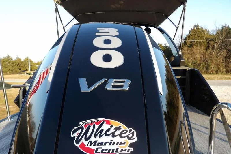 Slide: The Image of 2026 Bennington M Swingback 26 MSB with 300 V8 engine, White's Marine Center logo. - 51