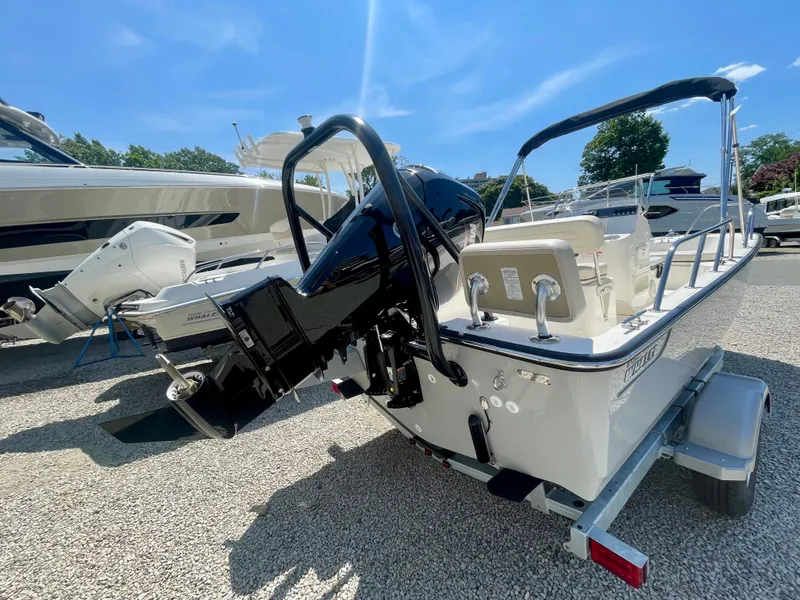Slide: The Image of A 2026 Boston Whaler 170 Montauk on a trailer. The outboard motor is visible. - 3