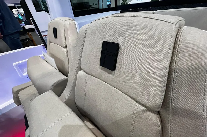 Slide: The Image of 2026 Axopar 29 XC Cross Cabin interior seats with beige upholstery. - 14