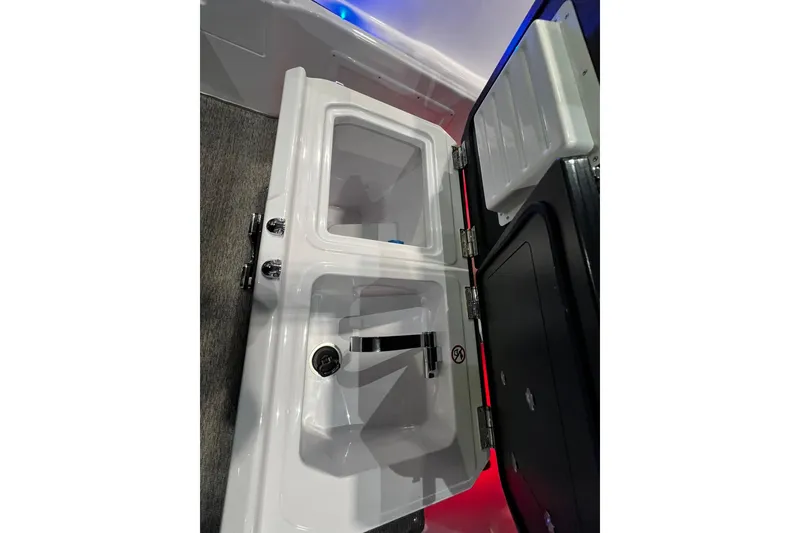 Slide: The Image of Interior view of 2026 Axopar 29 XC Cross Cabin sink and storage area. - 15