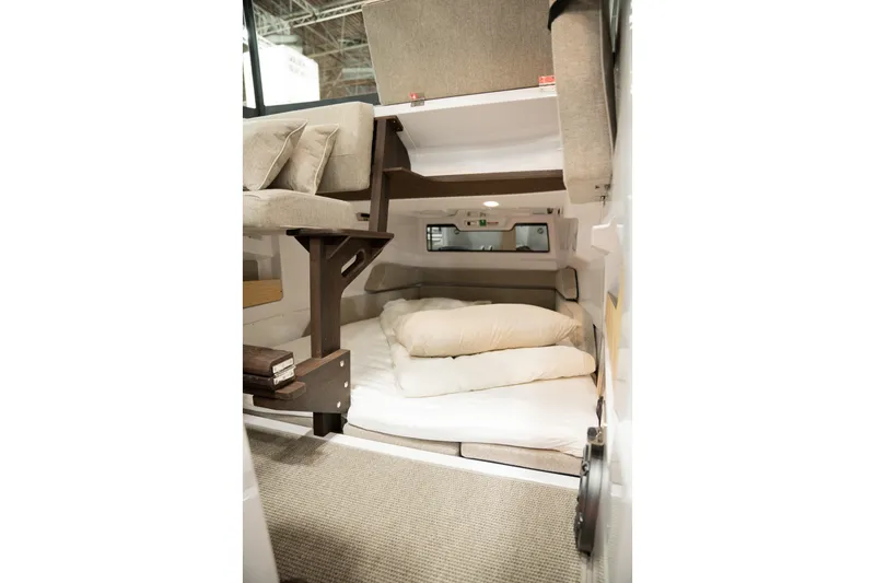 Slide: The Image of 2026 Axopar 29 XC Cross Cabin interior with cozy sleeping area and modern design. - 6