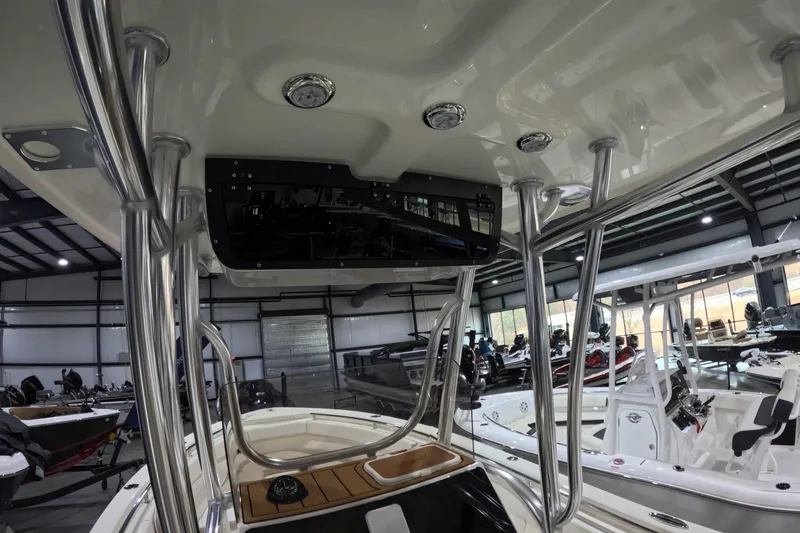 Slide: The Image of 2026 Bulls Bay 255 Center Console boat interior with stainless steel framework in showroom. - 11