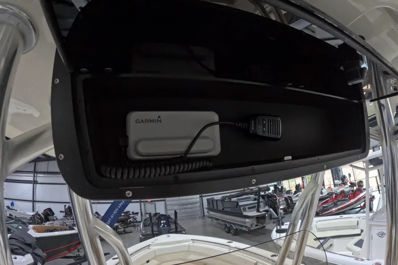 Slide: The Image of 2026 Bulls Bay 255 Center Console boat with Garmin device in storage compartment. - 12