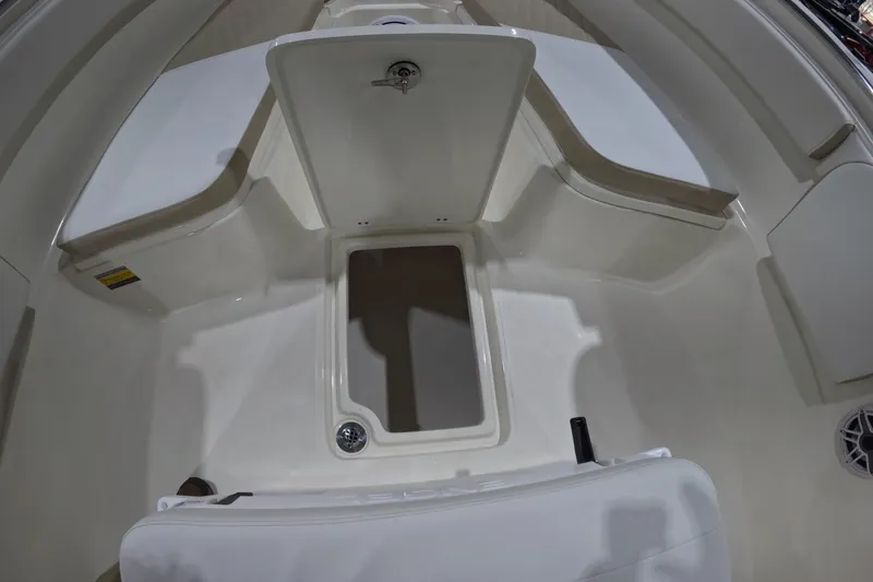 Slide: The Image of 2026 Bulls Bay 255 Center Console boat interior with seating and storage compartments. - 16