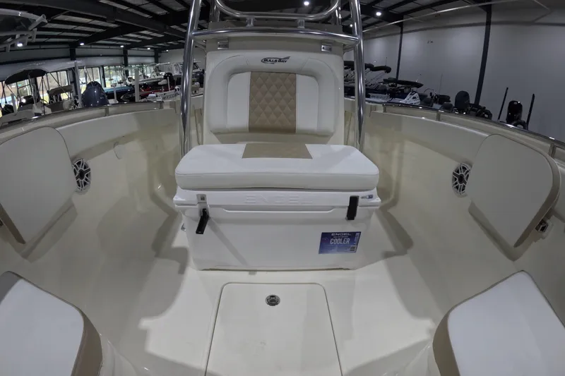 Slide: The Image of 2026 Bulls Bay 255 Center Console boat interior with seating and cooler. - 17