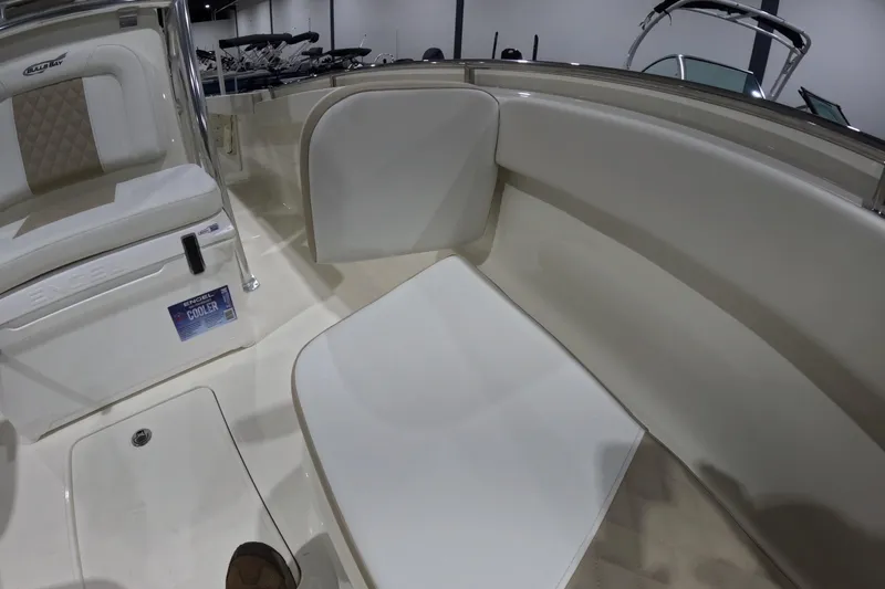 Slide: The Image of 2026 Bulls Bay 255 Center Console boat interior with seating and cooler. - 19