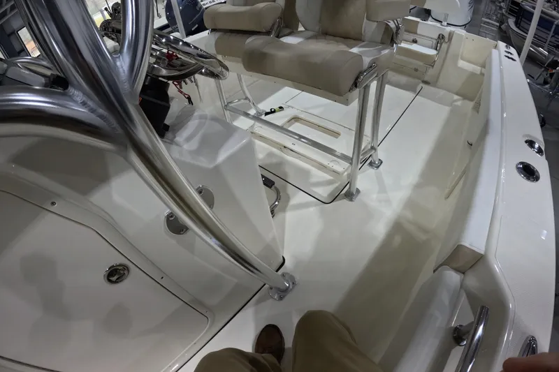 Slide: The Image of 2026 Bulls Bay 255 Center Console boat interior with steering and seating. - 22